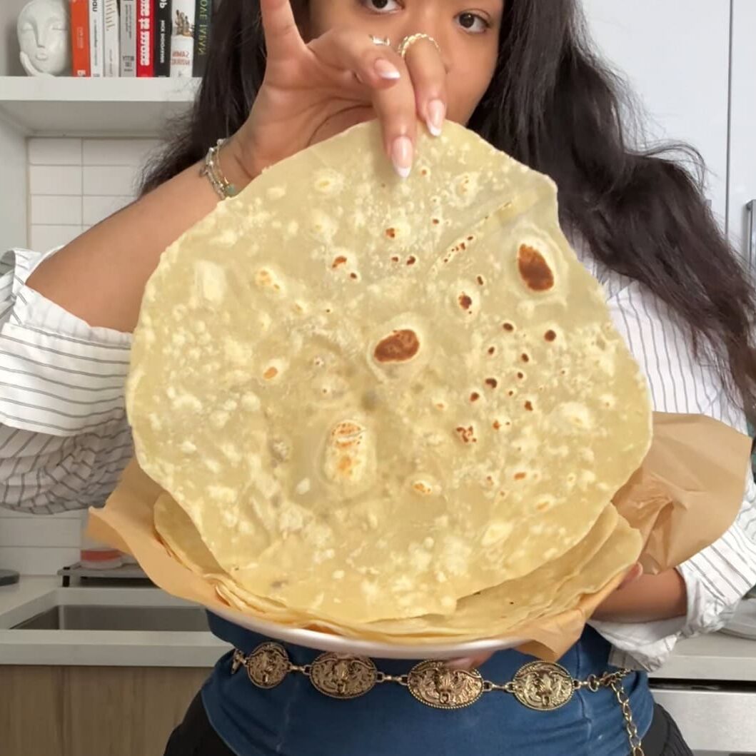 Stack of soft homemade flour burrito tortillas with golden brown spots - Hungry Mockingbird