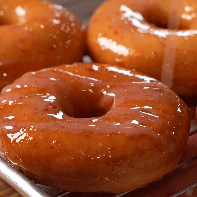 Fluffy homemade fried donuts with a crackly pink strawberry glaze - Hungry Mockingbird