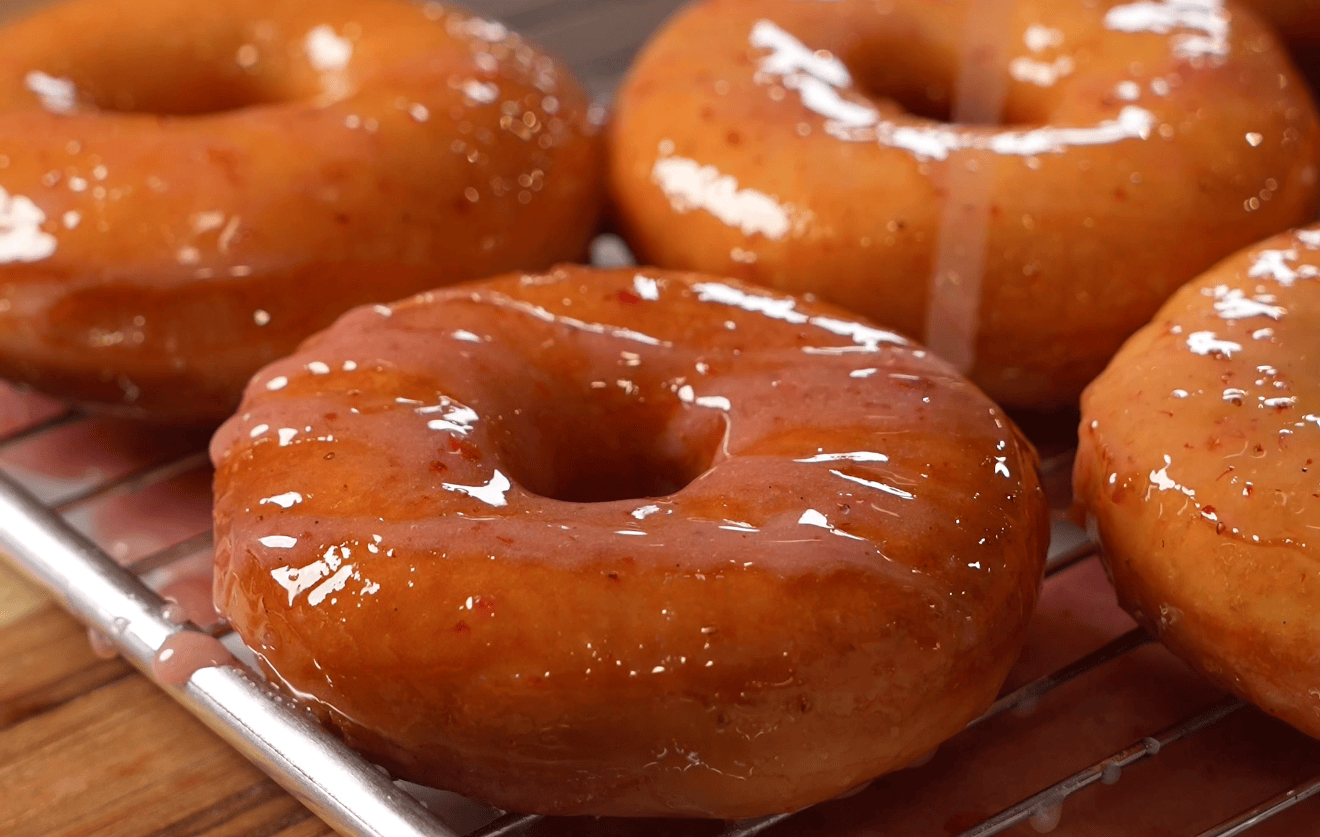 Fluffy homemade fried donuts with a crackly pink strawberry glaze - Hungry Mockingbird